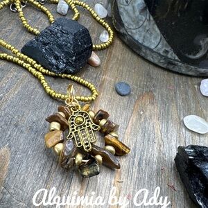 Tiger's eye medallion brass hamsa short necklace in gold beaded seeds pendant